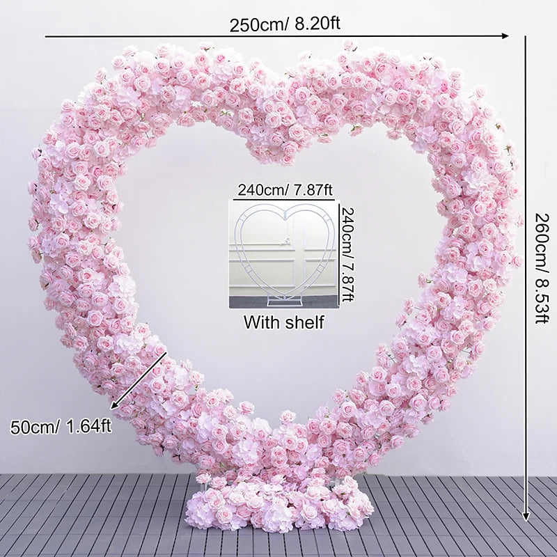 Heart-shaped pink floral arch with measurements on a white background