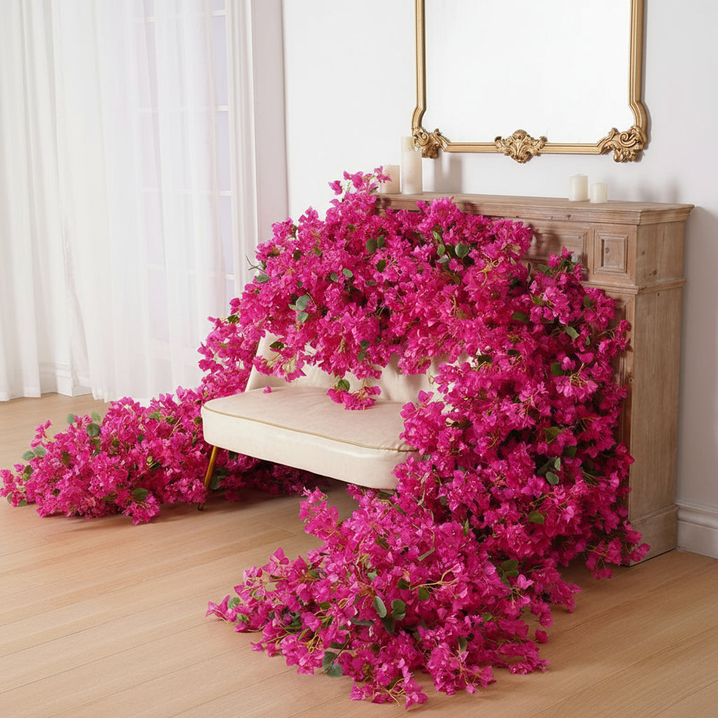 Pink flowers draped over a white chair with a decorative mirror in the background.