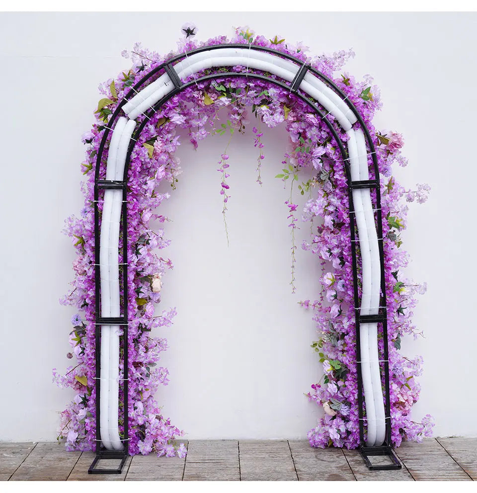 Decorative arch with purple flowers against a white background