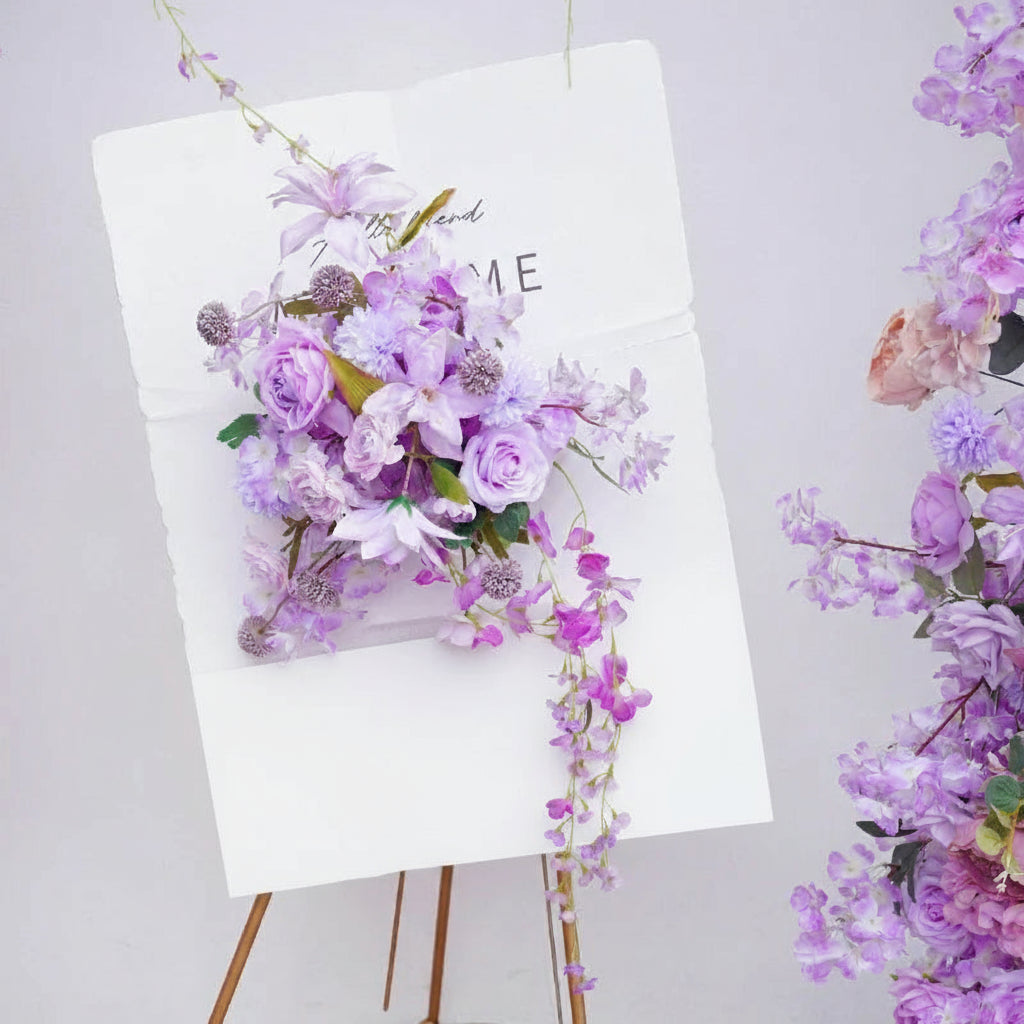 Floral arrangement on a stand with 'ANGELA FLOWER' branding against a light background
