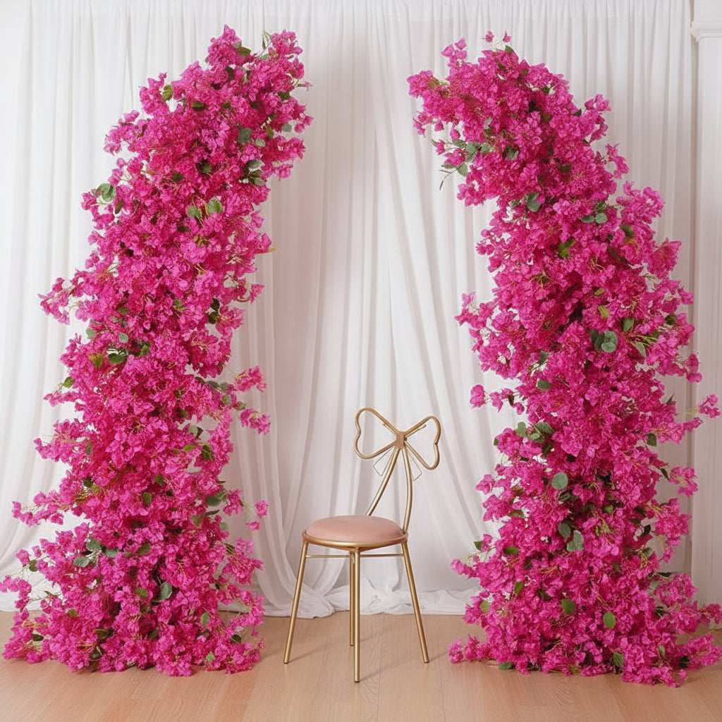 Two pink floral arches with a gold chair in the center, branded 'weddingstoryshop'
