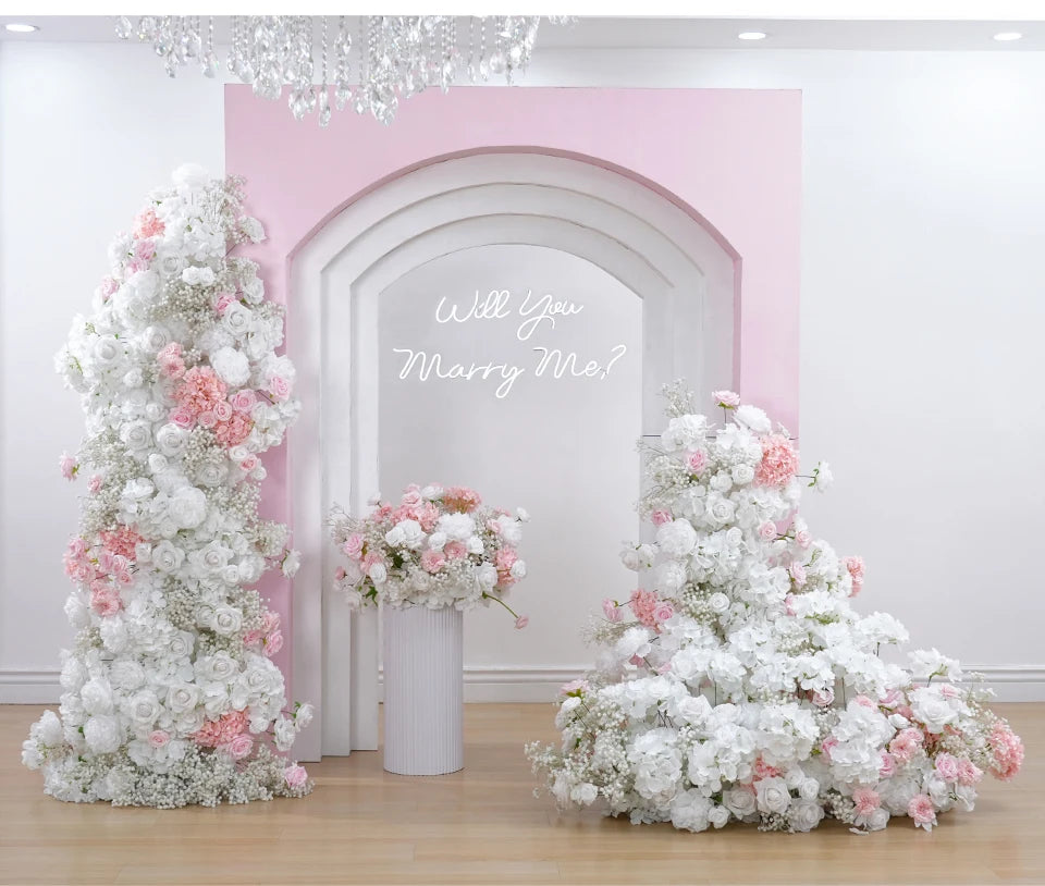 Floral arrangement with 'Will You Marry Me?' text in a decorative setting