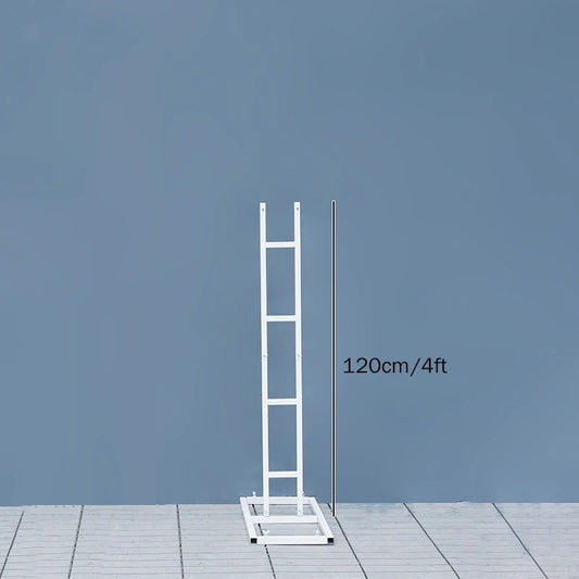 White ladder against a blue wall with measurement text