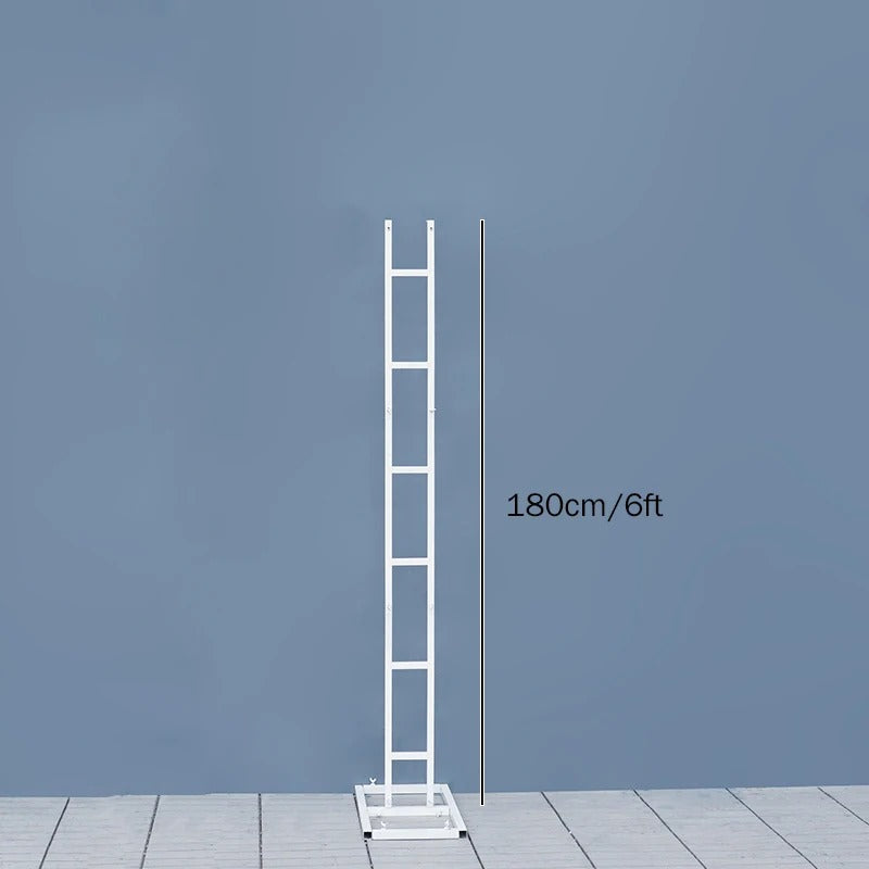 White ladder against a blue wall with measurement text